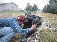  Tim inspects the smokebox of the Consolidation - while fire is going!  Very interesting - you could see how the petticoat worked, the smoke just curled around the petticoat and up the smokestack.